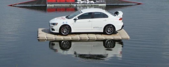 Candock floating a car. Yeah, it can handle our kayaks.  :)